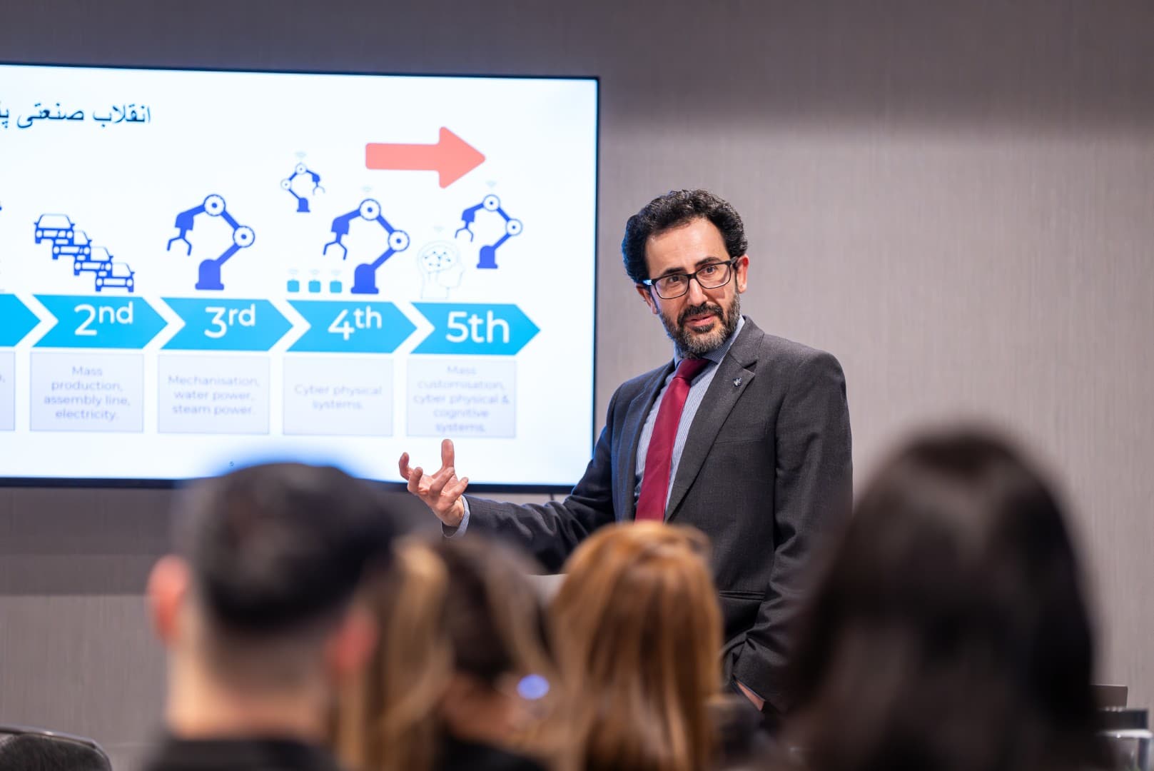 Speaker presenting to an audience at Eventar's Reframe event
