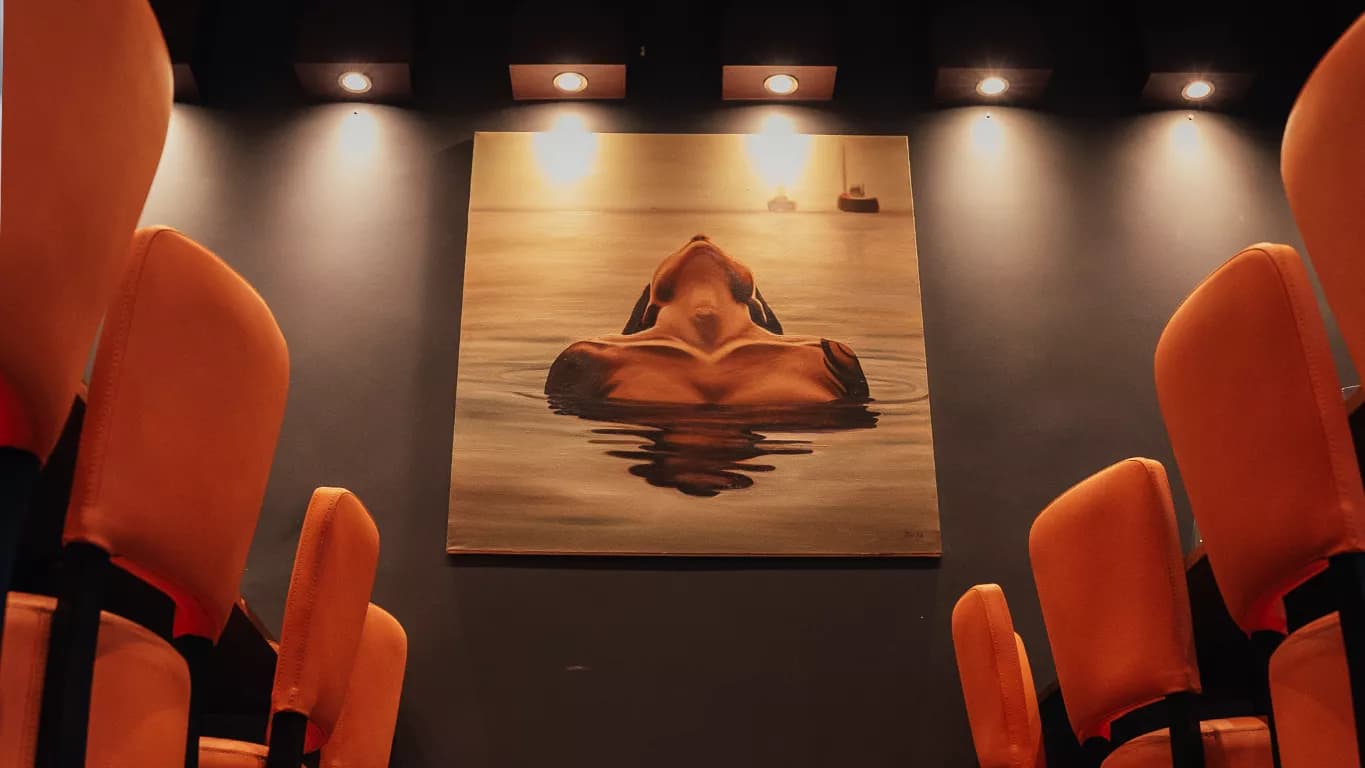 Istanbul Grill Radcliffe dining room with orange chairs and wall artwork